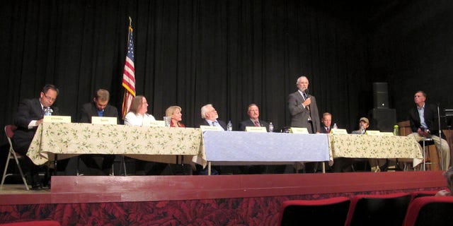June 30, 2014: Dan Newhouse, a U.S. House candidate running in the 4th District of Washington, standing, speaks as other candidates listen, at a forum in Othello, Wash. A total of 13 candidates are running to replace U.S. Rep. Doc Hastings.
