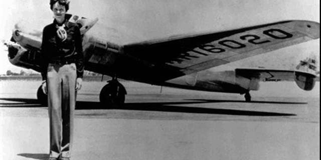 Amelia Earhart stands next to a Lockheed Electra 10E, before her last flight in 1937 from Oakland, Calif.