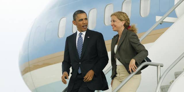 President Barack Obama and Democratic National Committee Chair, Rep. Debbie Wasserman Schultz, D-Fla. step off Air Force One in Miami, Friday, April 29, 2011. (AP Photo/Charles Dharapak)