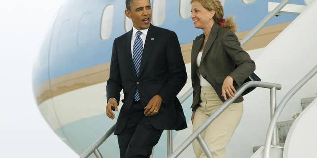 President Barack Obama and Democratic National Committee Chair, Rep. Debbie Wasserman Schultz, D-Fla. step off Air Force One in Miami, Friday, April 29, 2011. (AP Photo/Charles Dharapak)