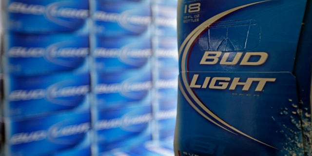 Jan. 28, 2013: File photo, Bud Light beer is shown in the aisles of Elite Beverages in Indianapolis. Beer lovers across the country have filed $5 million class-action lawsuits accusing Anheuser-Busch of watering down its Budweiser, Michelob and other brands.