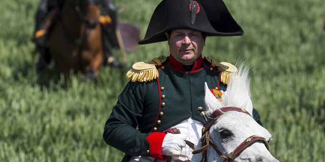 Frenchman Frank Samson takes part in the re-enactment of the battle of Ligny, as French Emperor Napoleon, during the bicentennial celebrations for the Battle of Waterloo, in Ligny, Belgium, June 14, 2015.
