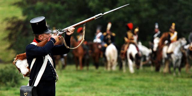 Actors dressed as soldiers re-enact the Battle of Waterloo in Braine-l'Alleud, near Waterloo, Belgium.