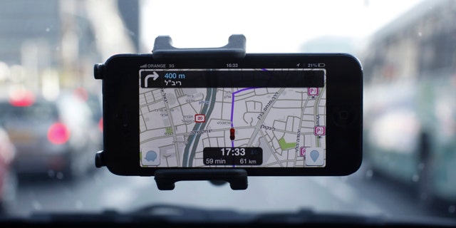 The Waze application is seen on a smartphone in this photo illustration taken in Tel Aviv May 9, 2013.