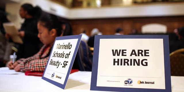 SAN FRANCISCO, CA - MARCH 27: A "we are hiring" sign is displayed on a table during the San Francisco Hirevent job fair at the Hotel Whitcomb on March 27, 2012 in San Francisco, California. As the national unemployment rate stands at 8.3 percent, job seekers turned out to meet with recruiters at the San Francisco Hirevent job fair where hundreds of jobs were available. (Photo by Justin Sullivan/Getty Images)