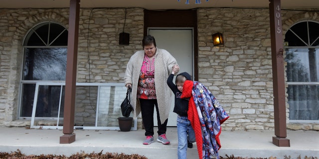 Mary-Jane Harrison plays with her grandson David, in San Antonio. Like nearly 78 million American adults, Harrison is obese, and because of stress fractures in her legs she is unable to able to walk up or down the stairs of her two-story home. (AP Photo/Eric Gay)