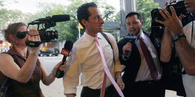 Rep. Anthony Weiner is surrounded by reporters as he arrives at his house in the Queens borough of New York June 9. (AP)