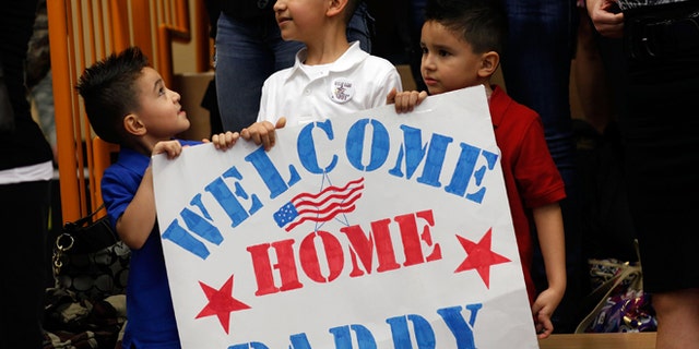 Family members wait for their loved ones of the 170th U.S. Army Infantry Brigade upon the troops' return from Afghanistan at U.S. Army Garrison Baumholder on January 28, 2012 in Baumholder, Germany. (Photo by Ralph Orlowski/Getty Images)