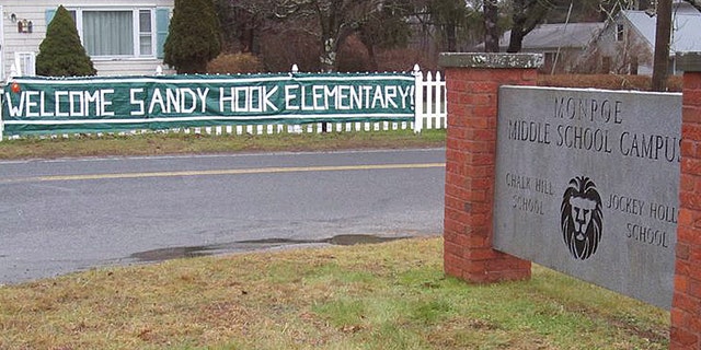 This December 2012 photo provided by The Newtown Bee shows a sign welcoming Sandy Hook Elementary School students, of Newtown, Conn., to the Chalk Hill School campus in neighboring Monroe, Conn. An open house was planned for the Sandy Hook students Wednesday, Jan. 2, 2013 at the former Chalk Hill School, overhauled specially for them. Classes for the Sandy Hook students start there on Thursday. (AP Photo/The Newtown Bee, Andy Hutchison)