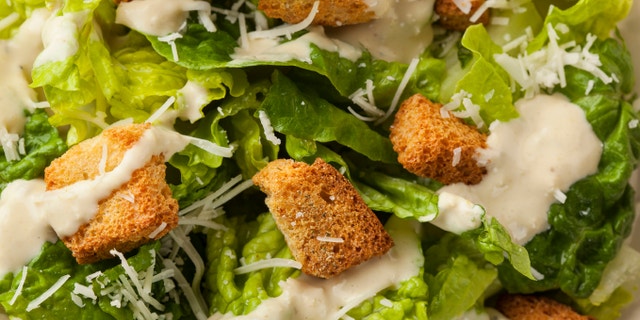 Healthy Green Organic Caesar Salad with Cheese and Croutons