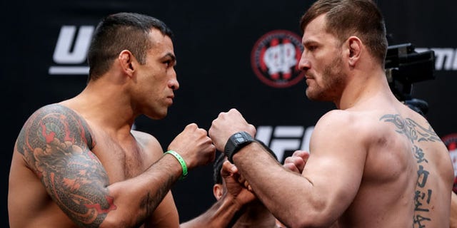 CURITIBA, BRAZIL - MAY 13:  (L-R) Opponents Fabricio Werdum of Brazil and Stipe Miocic of the United States face off during the UFC 198 weigh-in at Arena da Baixada stadium on May 13, 2016 in Curitiba, Brazil. (Photo by Buda Mendes/Getty Images)