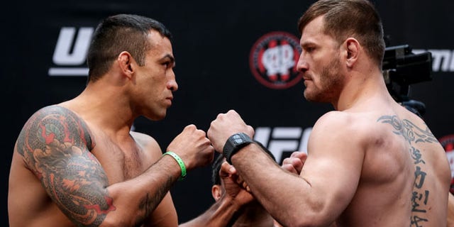 CURITIBA, BRAZIL - MAY 13: (L-R) Opponents Fabricio Werdum of Brazil and Stipe Miocic of the United States face off during the UFC 198 weigh-in at Arena da Baixada stadium on May 13, 2016 in Curitiba, Brazil. (Photo by Buda Mendes/Getty Images)