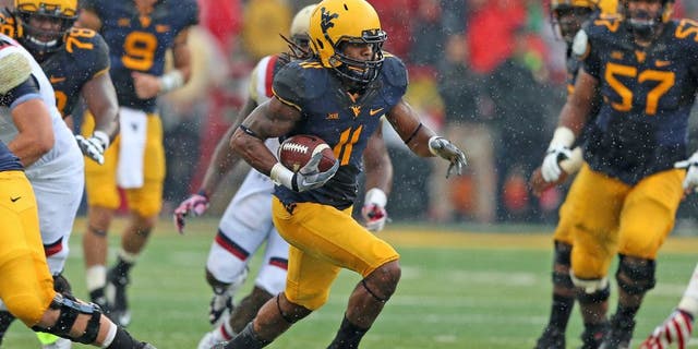 Sep 13, 2014; College Park, MD, USA; West Virginia Mountaineers wide receiver Kevin White (11) gains yards after his catch against the Maryland Terrapins at Byrd Stadium. Mandatory Credit: Mitch Stringer-USA TODAY Sports