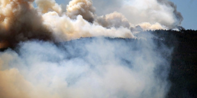 June 12, 2012: Smoke billows from a wildfire burning west of Fort Collins, Colo.