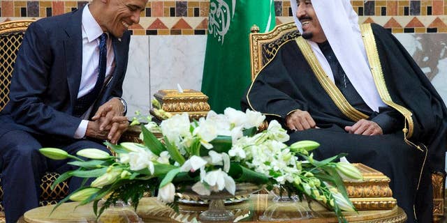 FILE - In this Jan. 27, 2015 file photo, President Barack Obama meets Saudi Arabian King Salman in Riyadh, Saudi Arabia. The Obama administration is greeting King Salman of Saudi Arabia with assurances that a nuclear deal with Iran also comes with the necessary resources to help check its regional ambitions. (AP Photo/Carolyn Kaster, File)