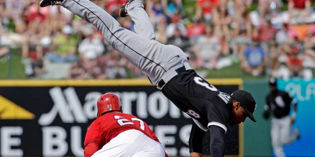 Los Angeles Angels' Mike Trout slides safely under Chicago White Sox's Micah Johnson as he steals second during the second inning of an exhibition spring training baseball game Thursday, March 13, 2014, in Tempe, Ariz. (AP Photo/Morry Gash)