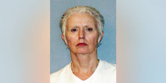 FILE - This undated file photo provided by the U.S. Marshals Service shows Catherine Greig, longtime girlfriend of Whitey Bulger, who was captured with Bulger in 2011 in Santa Monica, Calif. Greig pleaded guilty in federal court in Boston in 2012 and is serving an eight-year sentence for identity fraud and conspiracy to harbor a fugitive. Greig was indicted Tuesday, Sept. 22, 2015, on one count of criminal contempt that alleges she refused to testify since December 2014 whether other people helped Bulger during his 16 years on the run. (AP Photo/U.S. Marshals Service, File)