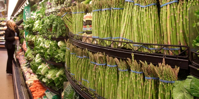 March 1: A customer scans fresh vegetables at a Kroger Co. supermarket in Cincinnati. Wholesale prices jumped last month by the most in nearly two years due to higher energy costs and the steepest rise in food prices in 36 years.