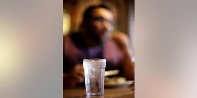 A glass of tap water with ice is shown at Uncle Johns Pancake House in Toledo, Ohio Monday, Aug. 4, 2014.