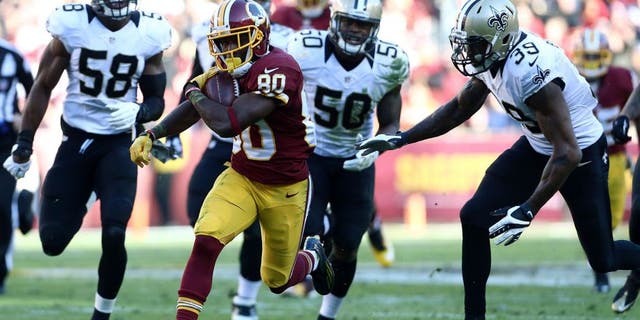 LANDOVER, MD - NOVEMBER 15: Wide receiver Jamison Crowder #80 of the Washington Redskins carries the ball past cornerback Brandon Browner #39 of the New Orleans Saints, middle linebacker Stephone Anthony #50 of the New Orleans Saints, linebacker James Anderson #58 of the New Orleans Saints in the second quarter of a game at FedExField on November 15, 2015 in Landover, Maryland. (Photo by Matt Hazlett/Getty Images)