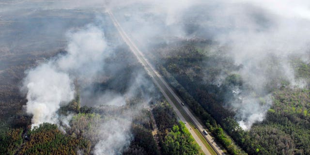 Mar. 1: Flames from a wildfire still burn on both sides of Interstate 95 in the north part of Brevard county as over 10,000 acres burn near the Volusia & Brevard County line in Scottsmoor, Fla.