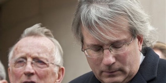Nov. 8: Dr. William A. Petit Jr. , right, and his father William Petit, left, react to the sentence given to Steven Hayes following jury deliberations at the New Haven, Conn. , County Courthouse (AP).