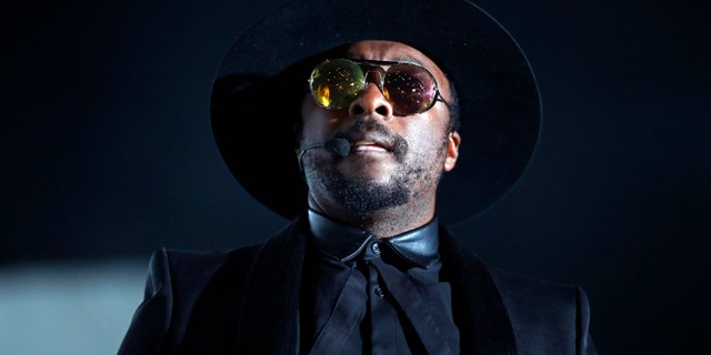 Recording artist Will.i.am performs at Bercy stadium in Paris, December 16, 2013.
