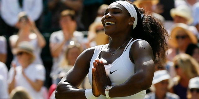 Serena Williams of the United States gestures after winning the singles match Garbine Muguruza of Spain after the women's singles final at the All England Lawn Tennis Championships in Wimbledon, London, Saturday July 11, 2015. Williams won 6-4, 6-4. (AP Photo/Kirsty Wigglesworth)
