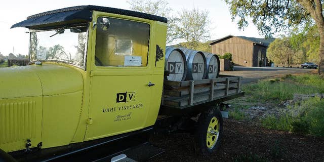 FILE - In this March 18, 2015 file photo, a 1926 Model T Ford truck is parked at the entrance to Dahl Vineyards in Yountville, Calif. A police dispatcher told police that a man later identified as a Silicon Valley investor had been shot and wounded while an assailant chased him through a California vineyard, according to the 911 recordings released Tuesday, March 24, 2015. The tapes show police arrived at Dahl Vineyards shortly before noon, four minutes after the initial 911 call and just moments before authorities say vintner Robert Dahl shot Emad Tawfilis in the head at close range. Tawfilis died at the scene. Dahl then led police on a brief, high-speed chase through Napa Valley wine country before stopping and committing suicide with a shot to the head. (AP Photo/Eric Risberg, File)