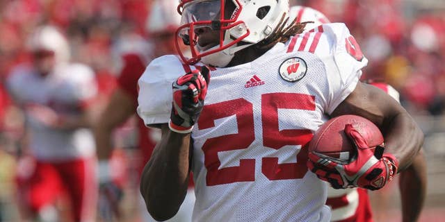 Wisconsin's Melvin Gordon carries the ball in the first half of the NCAA college football team's spring football game Saturday, April 12, 2014, in Madison, Wis. (AP Photo/Wisconsin State Journal, Amber Arnold)
