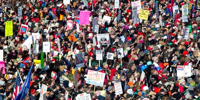 Saturday: Protesters attend a rally with Democratic senators who recently returned to Madison, Wis.
