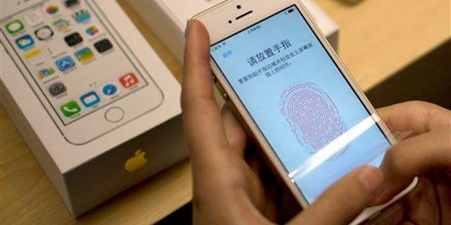 Apple's fingerprint technology on display at a store in Beijing.