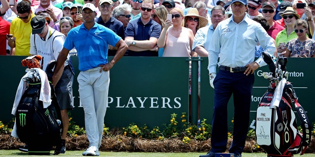 Tiger Woods, left, and Phil Mickelson.