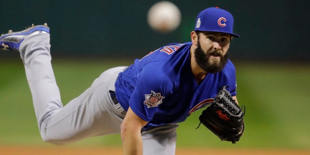 Chicago Cubs starting pitcher Jake Arrieta throws during the first inning of Game 2 of the Major League Baseball World Series against the Cleveland Indians Wednesday, Oct. 26, 2016, in Cleveland. (AP Photo/Gene J. Puskar)