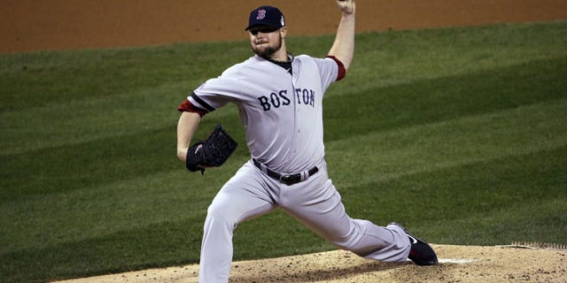 October 28, 2013: Boston Red Sox starting pitcher Jon Lester throws during the second inning of Game 5 of baseball's World Series against the St. Louis Cardinals Monday, Oct. 28, 2013, in St. Louis. (AP Photo/David J. Phillip)