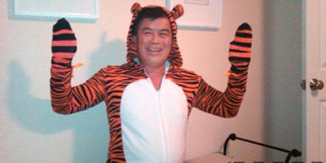 FILE - In this image provided by the Willamette Week newspaper, and taken Oct. 2, 2010 in Portland, Ore, U.S. Rep. David Wu is seen in a tiger costume. The Oregon congressman says that he accepted prescription drugs from a campaign contributor last October, around the time when members of his staff complained of his erratic behavior. Wu said the photos were taken while he was "joshing around" with his children in October just before Halloween. (AP Photo/Willamette Week)