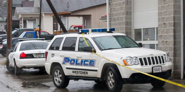 Dec. 1, 2014: Westover Police vehicles are parked outside Doug's Towing in Westover, W.V