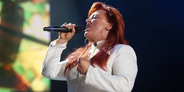 Wynonna Judd performs during the CMA Music Festival in Nashville, Tenn., Saturday, June 13, 2009. (AP Photo/Josh Anderson)