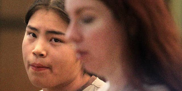 In this photo taken on Wednesday, Oct. 8, 2014, Phillip Sam walks out of the Laramie County Circuit Court after his initial appearance in Cheyenne., Wyo. Sam, 16, is accused of first-degree murder in the shooting death of 19-year-old Tyler Burns near Martin Luther King Jr. Park on Sunday. (AP Photo/The Wyoming Tribune Eagle, Blaine McCartney)