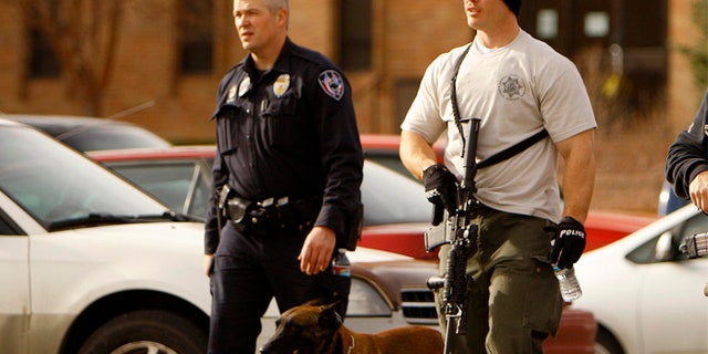 Nov. 30, 2012: Casper police leave the Wold Physical Science Building while investigating a murder and suicide at Casper College, Friday Nov. 30, 2012, in Casper, Wyo.