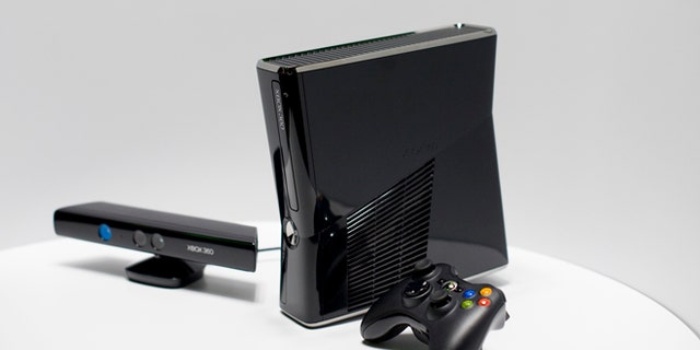 The new XBox 360 console and Kinect peripheral (L) is on display as it's revealed at Microsoft's press briefing ahead of the Electronic Entertainment Expo (E3) at the Wiltern Theater June 14, 2010 in Los Angeles, California. (Photo by Michal Czerwonka/Getty Images)