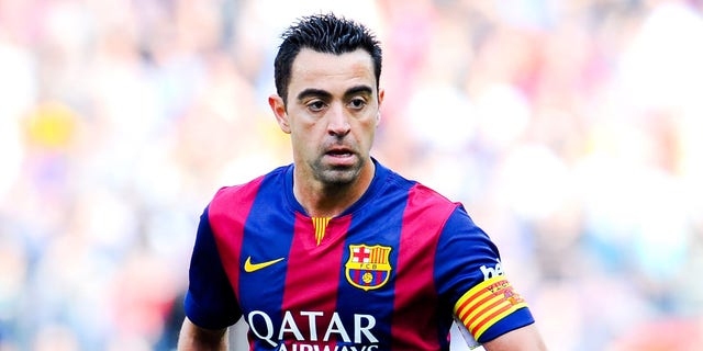 BARCELONA, SPAIN - APRIL 18:  Xavi Hernandez of FC Barcelona runs with the ball during the La Liga match between FC Barcelona and Valencia CF at Camp Nou on April 18, 2015 in Barcelona, Spain.  (Photo by David Ramos/Getty Images)