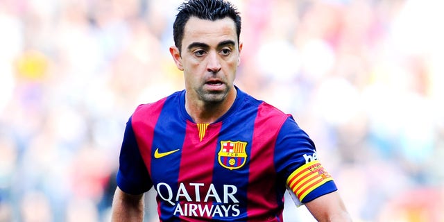 BARCELONA, SPAIN - APRIL 18: Xavi Hernandez of FC Barcelona runs with the ball during the La Liga match between FC Barcelona and Valencia CF at Camp Nou on April 18, 2015 in Barcelona, Spain. (Photo by David Ramos/Getty Images)