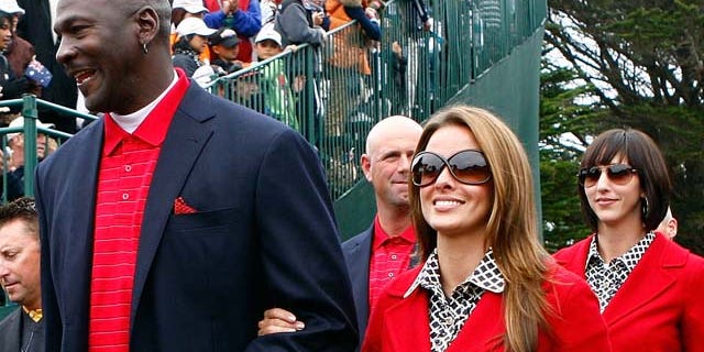 Oct.11, 2009: Michael Jordan of the USA Team walks with his girlfriend Yvette Prieto to the closing ceremonies during the Final Round Singles Matches of The Presidents Cup at Harding Park Golf Course in San Francisco, Calif.