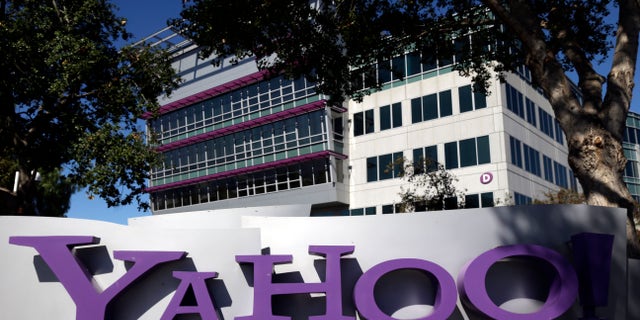 FILE - This Oct. 17, 2012, photo, shows a sign in front of Yahoo! headquarters in Sunnyvale, Calif. Yahoo says the government threatened to fine the company $250,000 a day if it did not comply with demands to go along with an expansion of U.S. surveillance laws by surrendering online information, a step the company regarded as unconstitutional. (AP Photo/Marcio Jose Sanchez, File)