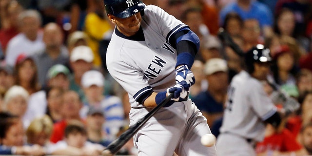 New York Yankees Alex Rodriguez hits a single in the seventh inning of a baseball game against the Boston Red Sox, Sunday, Aug. 18, 2013, in Boston. 