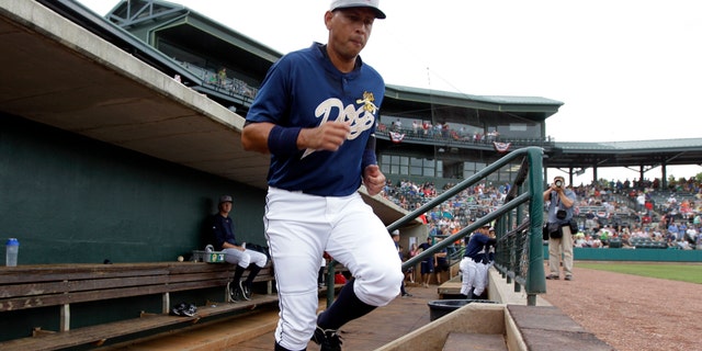 New York Yankees third baseman Alex Rodriguez takes the field during the first inning in his first rehab baseball game with the Charleston RiverDogs, against the Rome Braves in Charleston, S.C., Tuesday, July 2, 2013. (AP Photo/Chuck Burton)