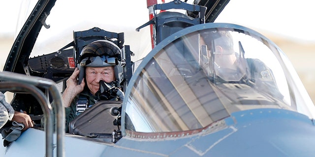Oct. 14: Retired Air Force Brig. Gen. Charles Yeager straps into an F-15D for a re-enactment flight commemorating his breaking of the sound barrier 65 years ago at Nellis Air Force Base, Nev.