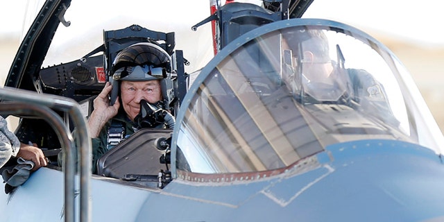 Oct. 14: Retired Air Force Brig. Gen. Charles Yeager straps into an F-15D for a re-enactment flight commemorating his breaking of the sound barrier 65 years ago at Nellis Air Force Base, Nev.