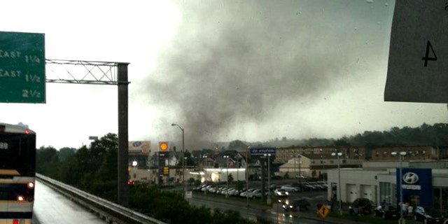 June 1, 2011: Traveling in a bus on Interstate Route 91, in Springfield, Mass., Michelle Gilbert photographed a funnel cloud that touched the ground in Springfield, Mass. causing widespread damage -- and the state's first tornado-related deaths in 16 years.
